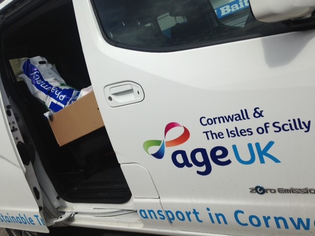 An Age UK Cornwall electric vehicle delivering goods. 