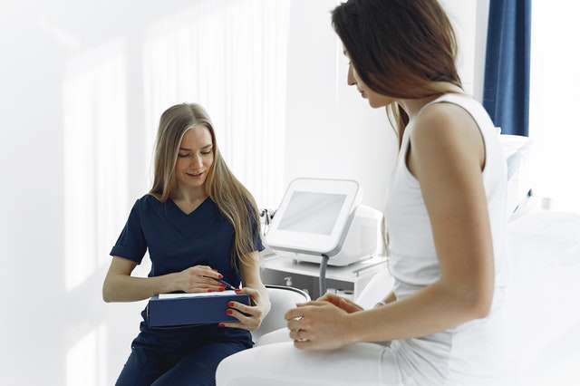A consultant looks after a patient. 